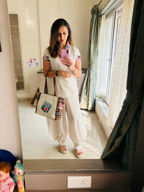 (DivyankaTripathi) Three Piece Off-White Drape Pant Set with Handbag