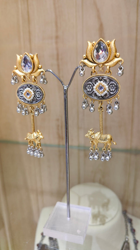Dual-Tone Cow Motif Earrings with Lotus Studs