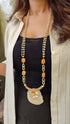 Long Beaded Necklace with Orange Beads and Shell Pendant
